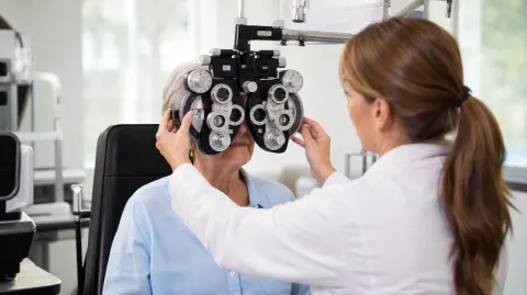 A woman having an eye exam at the optometrist